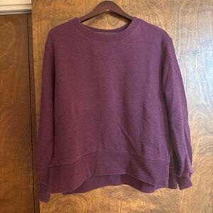 Purple crewneck sweatshirt with a relaxed fit
